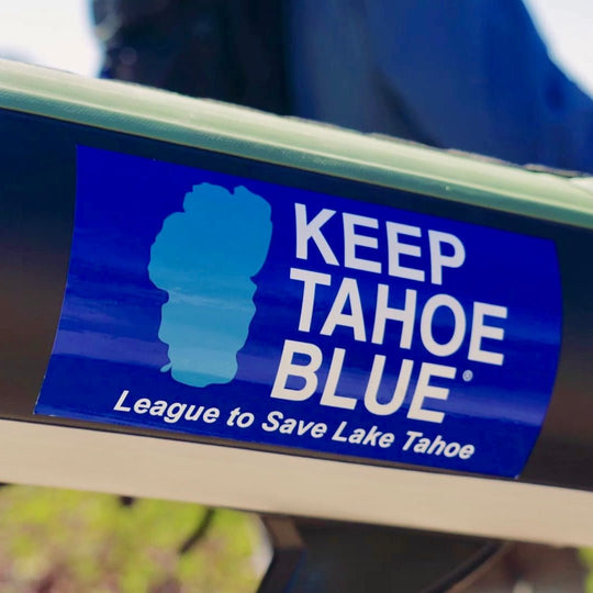 white and two tone blue classic bumper sticker on paddleboard at Lake Tahoe 