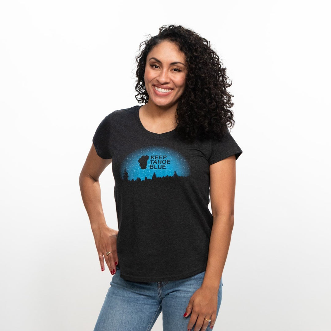 black v-neck t-shirt featuring forest silhouette with starry Keep Tahoe Blue logo