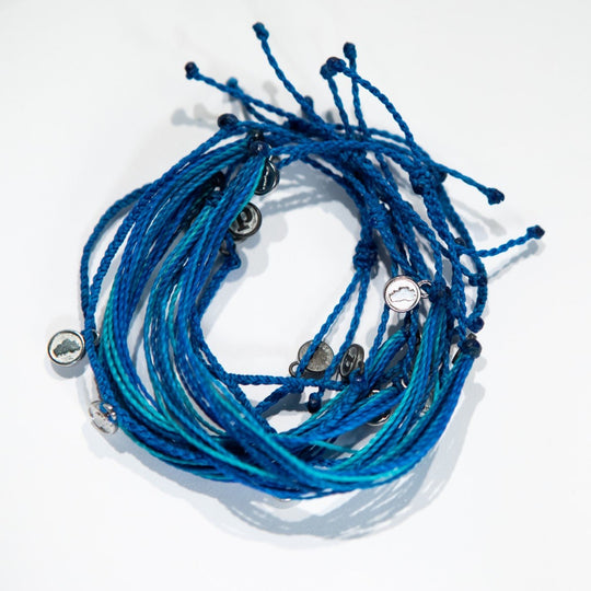 cluster of custom Keep Tahoe Blue Pura Vida string bracelets