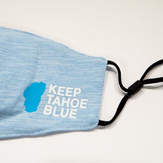 close up of powder blue face covering Keep Tahoe Blue logo