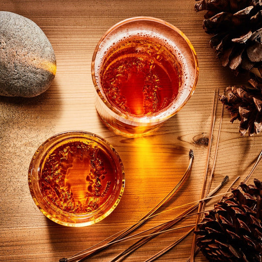 aerial view of glassware filled with drinks on wooden table