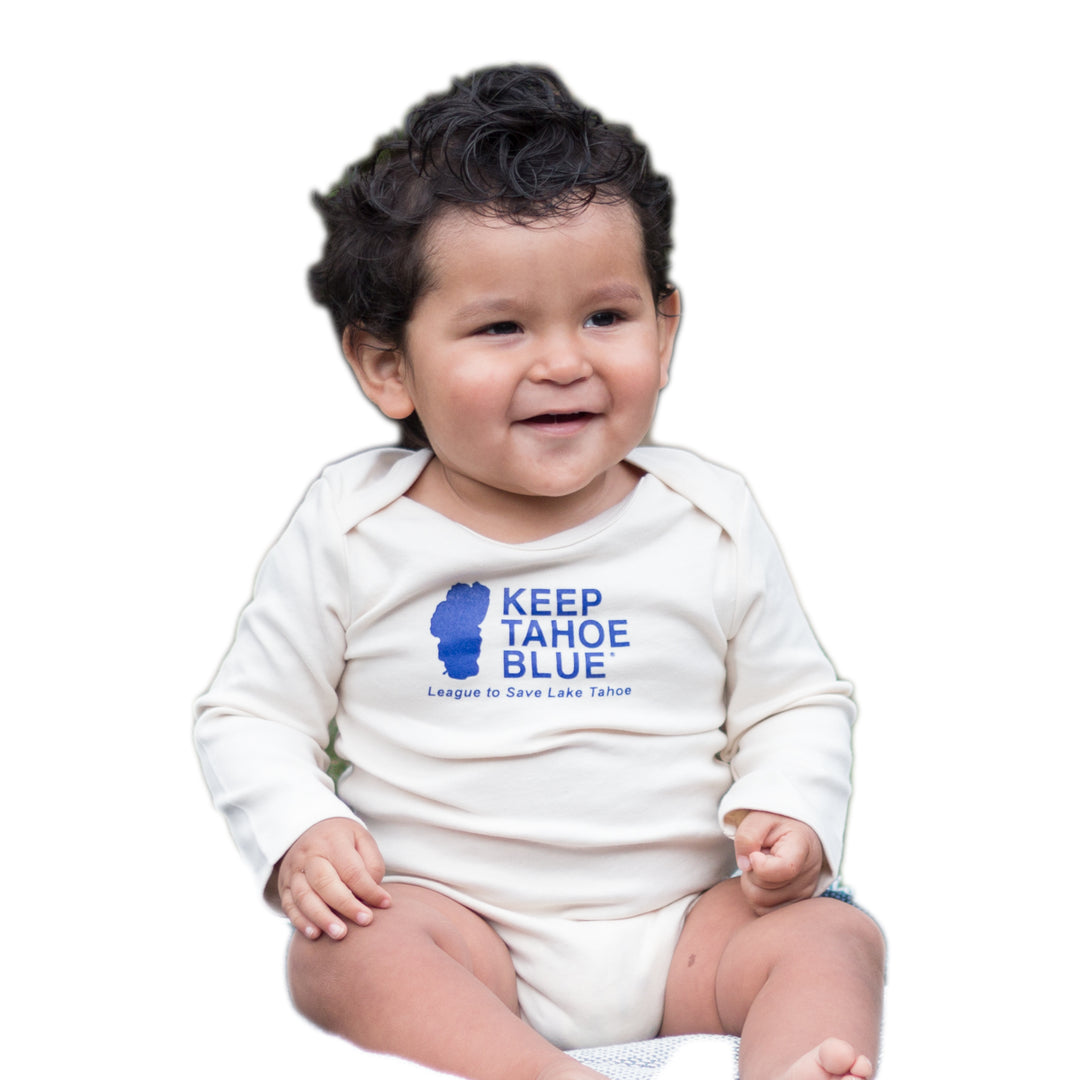 cream colored long sleeve baby bodysuit with blue Keep Tahoe Blue logo