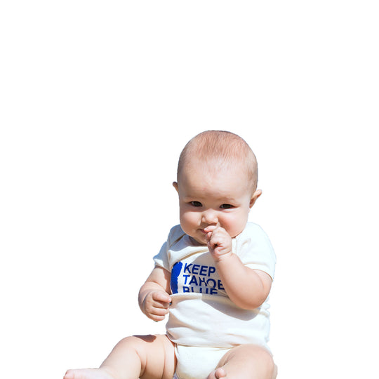 cream colored baby body suit with blue Keep Tahoe Blue logo