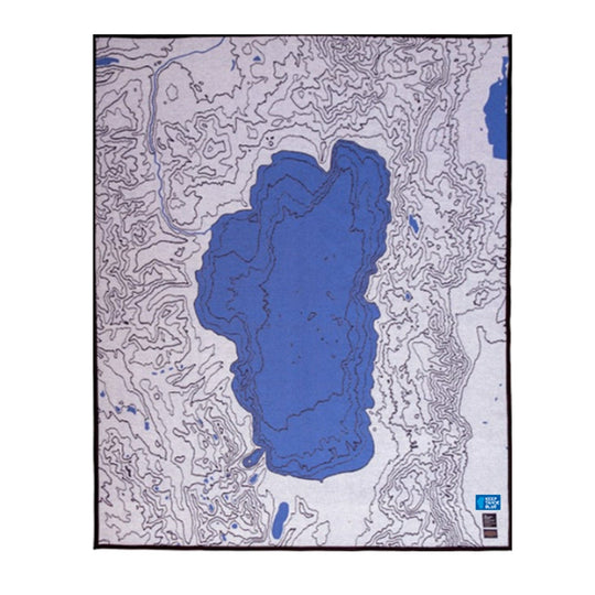 blue with grayish white heavy wool blanket featuring topographic map design of Lake Tahoe region 